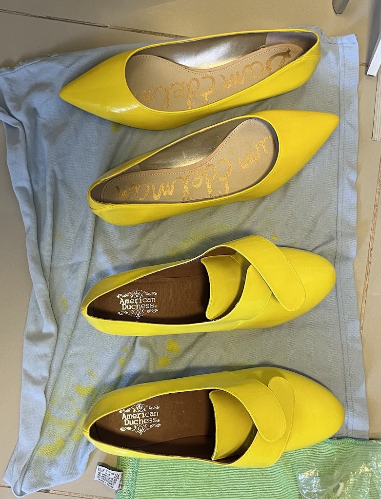 Two pairs of bright and shiny yellow 18th Century shoes drying on a towel. Top - 1790s slippers. Bottom - 1760s Kensingtons by American Duchess.
