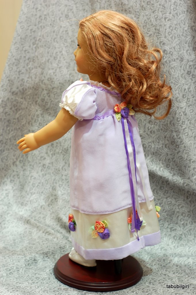 3/4 view of an american girl doll wearing a regency ballgown
