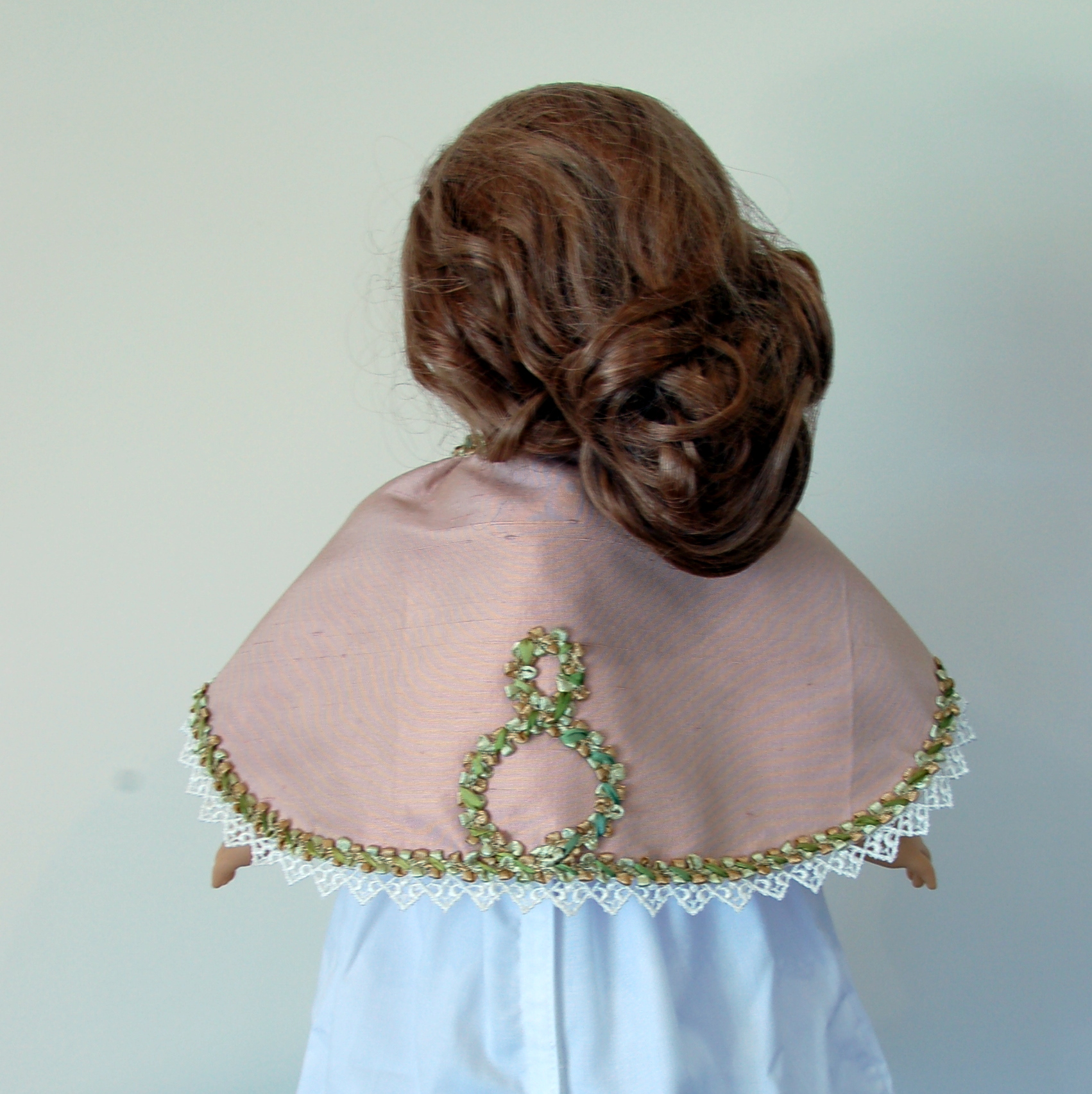 front view of a late victorian american girl doll capelet