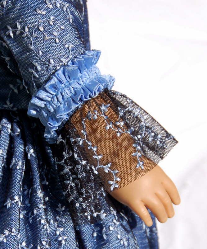 Close-up of the sleeve of an american girl rococo gown