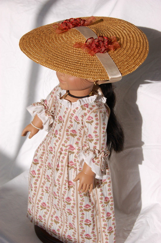 American Girl Doll Felicity wears a large straw bergere doll hat