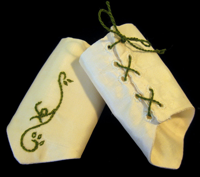 a pair of embroidered silk mitts for an american girl doll