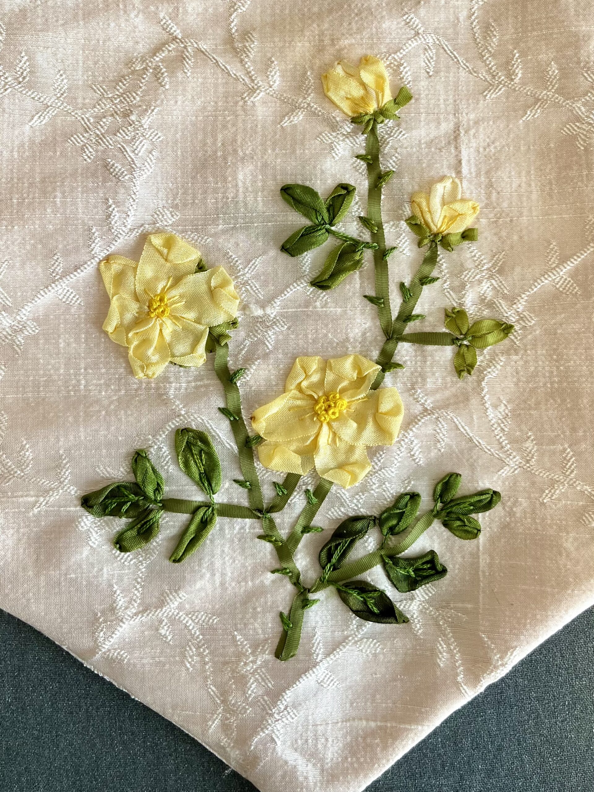 close-up of silk ribbon embroidered roses