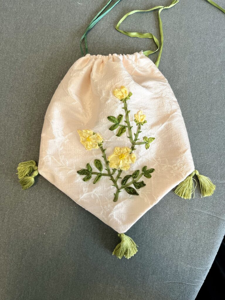 an regency reticule embroidered with yellow silk roses