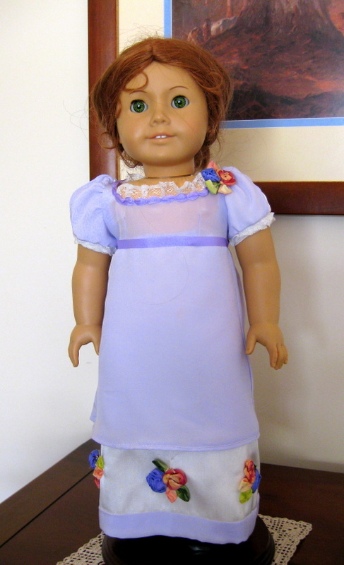 Front View of an American Girl Doll wearing a lavender silk regency ball gown
