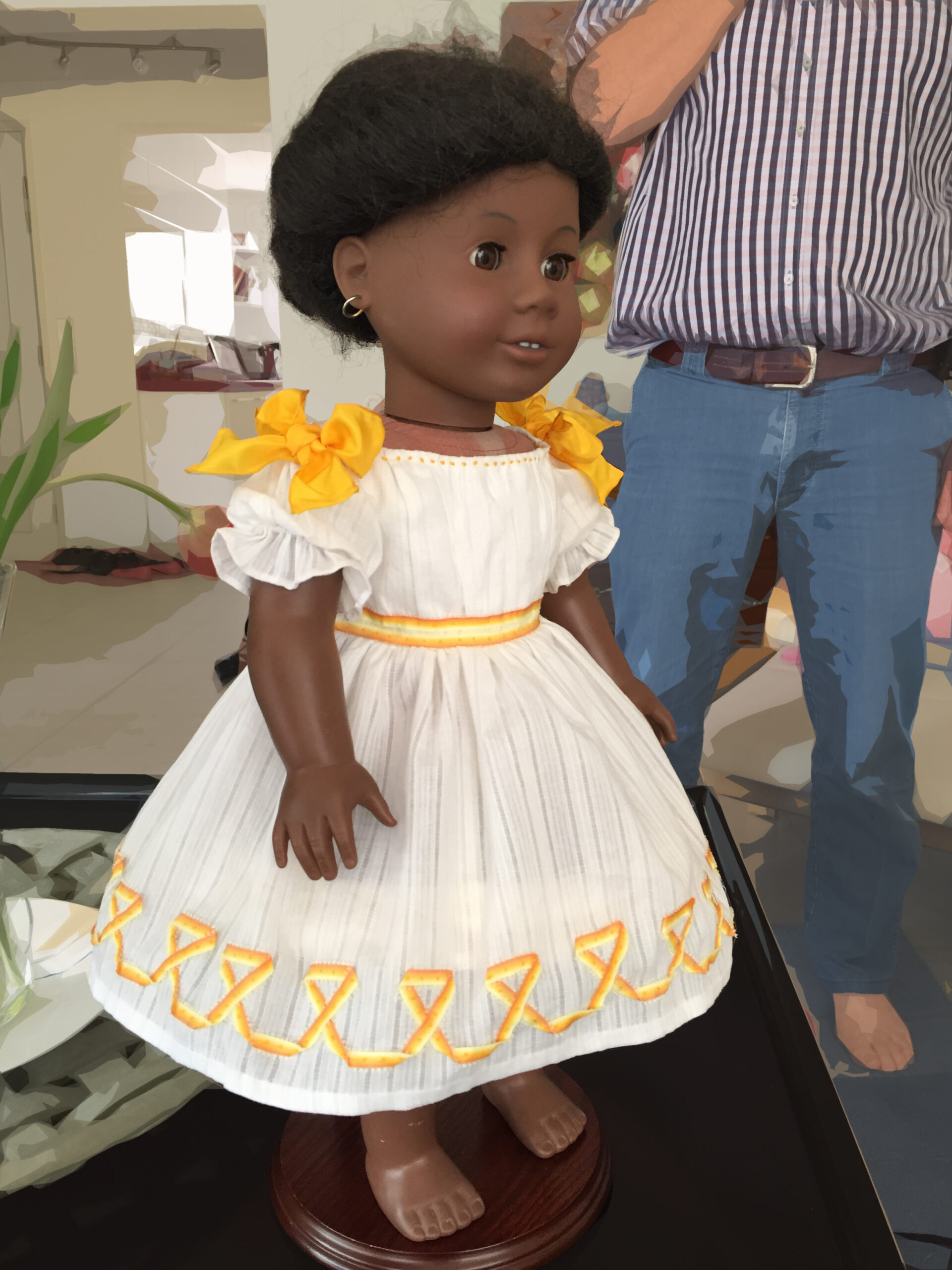 Side view of an American Girl doll wearing a white Winterhalter princess dress.