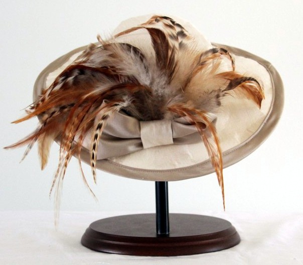 Enormous Edwardian doll hat decorated with feathers and a large bow