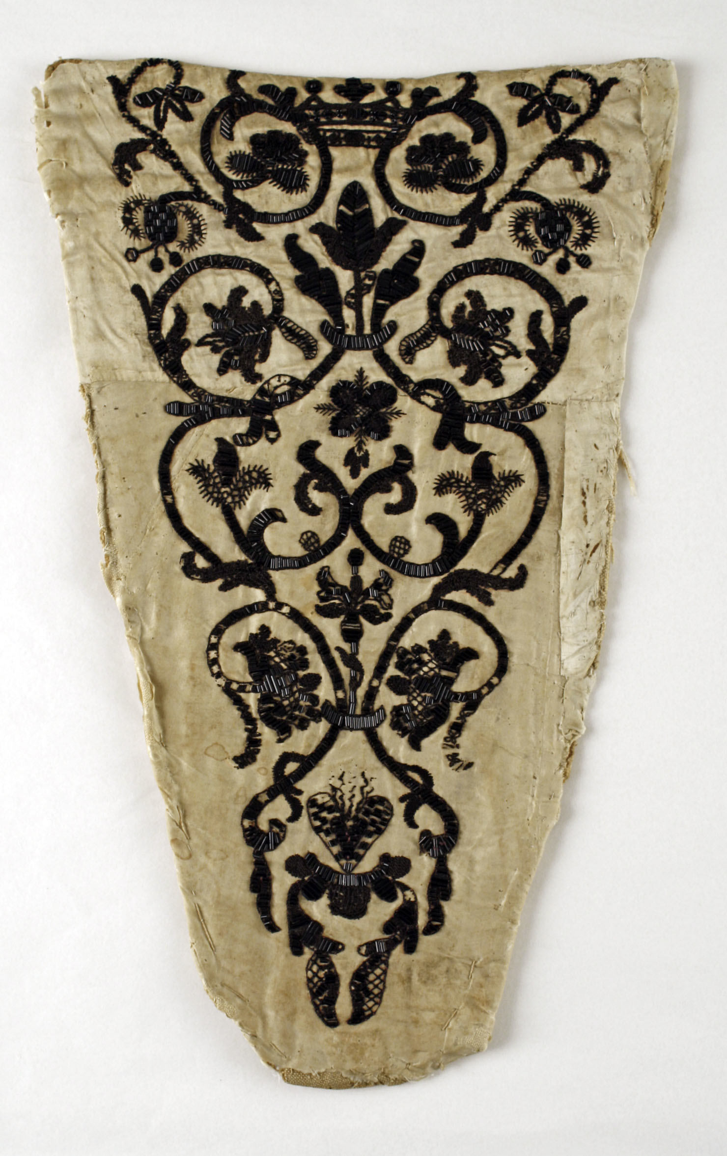 Beige Velvet Stomacher embroidered with Metallic thread in a foleate design.